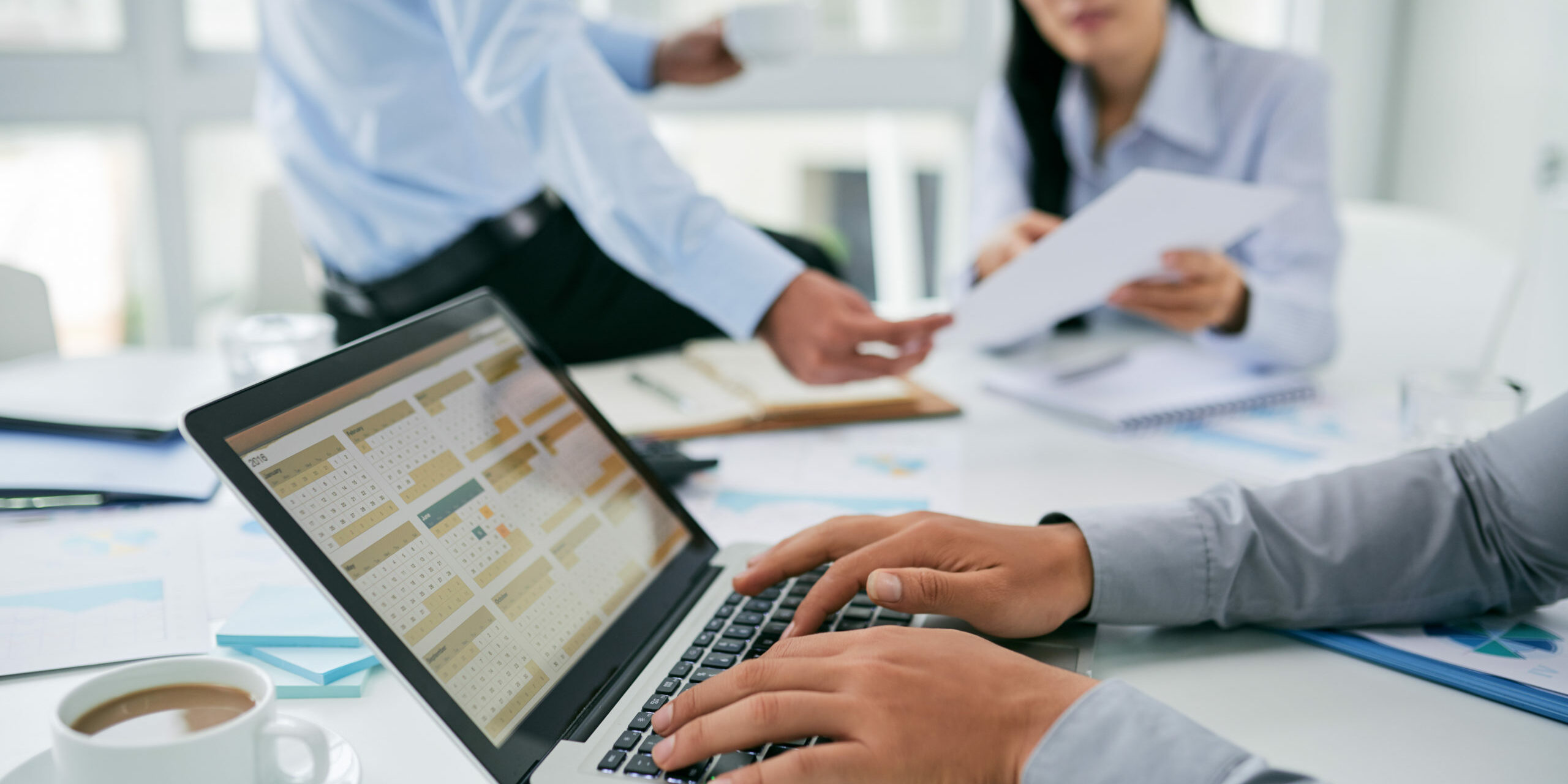 Close-up image of businessman checking calendar with daily agenda